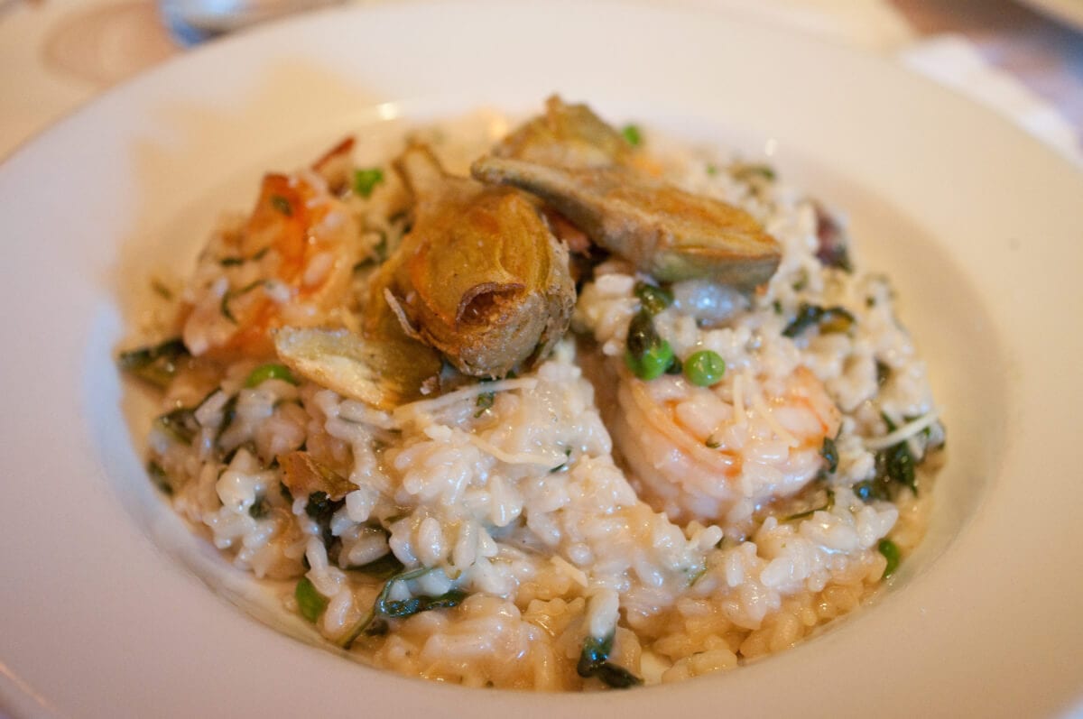 The Peasant and the Pear - Dinner. Spring Risotto with Grilled Shrimp: Arborio rice, spinach, garlic, fresh peas, charred lemon & crispy artichokes. Photo: Ernesto Andrade