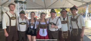 several people celebrating oktoberfest by dressing in traditional german attire