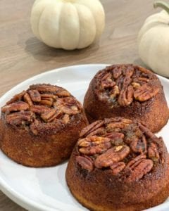 mini pumpkin cake topped with pecans