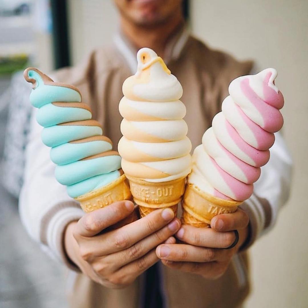 three colorful soft serve ice cream cones