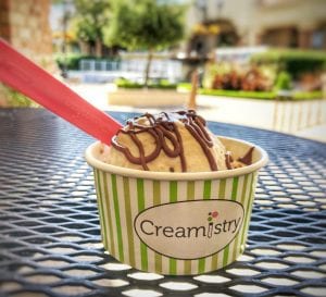cup of ice cream with hot fudge on top at creamistry