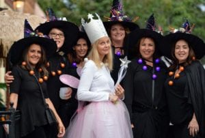 Women dressed as witches pose for the camera at Downtown Livermore's Witches Night Out