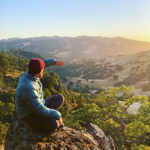 man overlooking valleys and hills at ohlone wilderness regional preserve