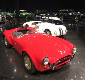 classic red automobile on gallery floor