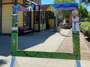 Picture This: Created by a local artist, large colorful frame to take photos in on display in a public park.