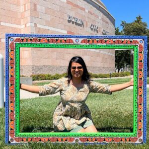 Picture This: Created by a local artist, large colorful frame to take photos in, on display in front of Dublin Civic Center. Smiling artist featured in the center of the frame.