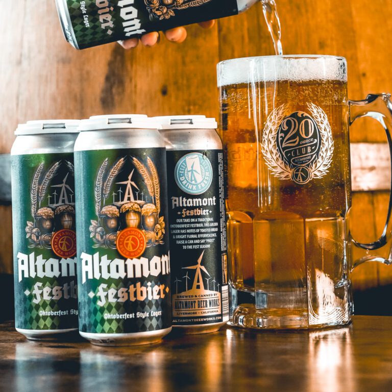 altamont beer works oktoberfest brew in cans and in a liter mug